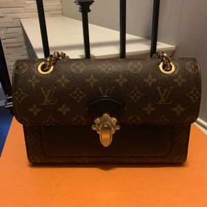 Louis Vuitton Victoire Monogram Bag